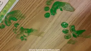 leprechaun trick of leaving little green footprints on the desk
