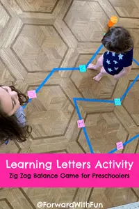 kids learning through movement on a blue tape line