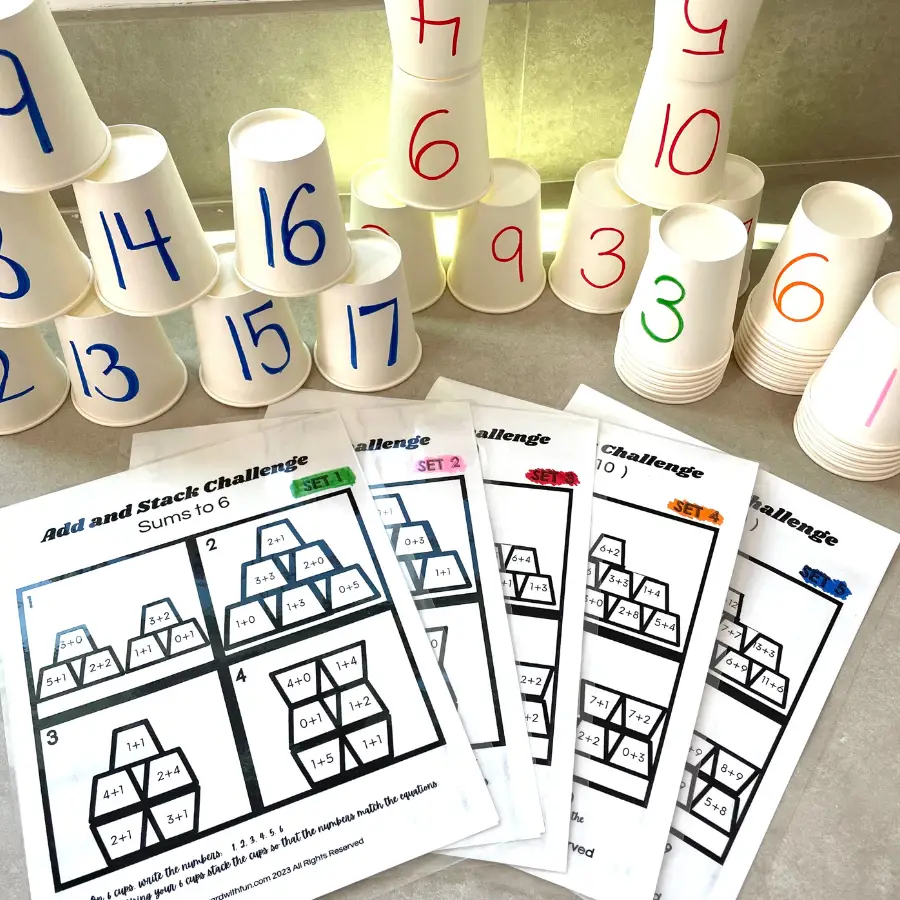 laminated 5 sets of addition cups with all the colors of cups behind them